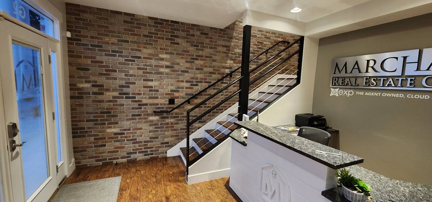 Brick feature wall in a real estate office